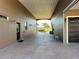 Spacious carport area with access to the garage and back entrance offering convenient covered parking at 394 Nolane Ln, Polk City, FL 33868