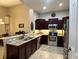 Bright kitchen featuring stainless steel appliances and a breakfast bar at 394 Nolane Ln, Polk City, FL 33868