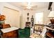 Guest bedroom featuring natural light, ceiling fan, and closet for optimal storage at 3976 Cypress W Lndg, Winter Haven, FL 33884