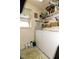 Well-equipped laundry room with shelving for storage and a window for natural light at 3976 Cypress W Lndg, Winter Haven, FL 33884