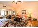 Inviting living room with a large area rug, comfortable seating, and wood-look flooring at 3976 Cypress W Lndg, Winter Haven, FL 33884
