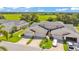An inviting two-story townhome with a two-car garage and lush green surroundings at 42 Enclave Dr, Winter Haven, FL 33884