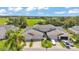 An inviting two-story townhome with a two-car garage and lush green surroundings at 42 Enclave Dr, Winter Haven, FL 33884