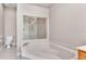 The bathroom features a large soaking tub and glass-enclosed shower at 42 Enclave Dr, Winter Haven, FL 33884