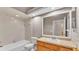 This bathroom has a single sink vanity, a mirror, and a shower/tub combo at 42 Enclave Dr, Winter Haven, FL 33884