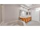A luxurious bathroom features a large soaking tub and dual vanity at 42 Enclave Dr, Winter Haven, FL 33884
