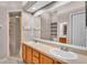 This bathroom has a dual sink vanity, a large mirror, and a shower at 42 Enclave Dr, Winter Haven, FL 33884