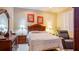 Comfortable bedroom with neutral tones, furnishings, and ample natural light from the window at 42 Enclave Dr, Winter Haven, FL 33884