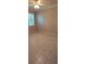 Bedroom with tile flooring, window with shutters, neutral walls, and a ceiling fan at 42 Enclave Dr, Winter Haven, FL 33884