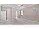 A neutral-toned bedroom is carpeted and features two entry doors at 42 Enclave Dr, Winter Haven, FL 33884