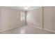This neutral bedroom has a ceiling fan, window with shutters, and tile flooring at 42 Enclave Dr, Winter Haven, FL 33884
