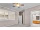 A neutral-toned bedroom features shuttered windows and an ensuite bathroom at 42 Enclave Dr, Winter Haven, FL 33884