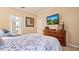 Inviting bedroom showcasing a dresser and a cozy bed, creating a relaxing atmosphere at 42 Enclave Dr, Winter Haven, FL 33884