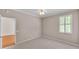 This neutral bedroom has a ceiling fan and tile flooring at 42 Enclave Dr, Winter Haven, FL 33884