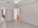 This neutral bedroom has a ceiling fan and tile flooring at 42 Enclave Dr, Winter Haven, FL 33884