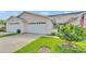 Charming townhome featuring well-manicured lawns and a two-car garage at 42 Enclave Dr, Winter Haven, FL 33884
