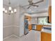Bright kitchen features stainless steel appliances and a large window, with light tan tiled floors at 42 Enclave Dr, Winter Haven, FL 33884