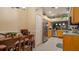 Charming kitchen with stainless steel appliances and tile floors next to dining area at 42 Enclave Dr, Winter Haven, FL 33884