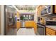 Bright kitchen featuring stainless steel appliances and a view into the adjacent dining area at 42 Enclave Dr, Winter Haven, FL 33884