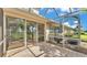 A large screened-in lanai offers an outdoor dining and cooking area at 42 Enclave Dr, Winter Haven, FL 33884