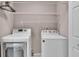 This laundry room includes a washing machine and a dryer at 42 Enclave Dr, Winter Haven, FL 33884
