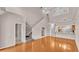 Bright living room with a staircase, hardwood floors, neutral paint and lots of natural light at 42 Enclave Dr, Winter Haven, FL 33884