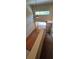 Open-concept living area with high ceilings, wood floors, and lots of natural light at 42 Enclave Dr, Winter Haven, FL 33884