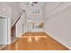 Bright living room with a staircase, hardwood floors, neutral paint and lots of natural light at 42 Enclave Dr, Winter Haven, FL 33884