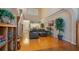 Spacious living room featuring hardwood floors, vaulted ceilings, and an open floor plan at 42 Enclave Dr, Winter Haven, FL 33884
