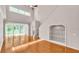 Bright living room with hardwood floors, a high ceiling, and sliding glass doors leading to the outside at 42 Enclave Dr, Winter Haven, FL 33884