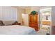 Comfortable bedroom with a large bed, walk in closet and an ensuite bathroom at 42 Enclave Dr, Winter Haven, FL 33884
