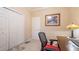 Well-lit office space with a desk and tiled floor and closet for storage at 42 Enclave Dr, Winter Haven, FL 33884