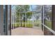 Relaxing screened porch with views of the backyard and greenery at 42 Enclave Dr, Winter Haven, FL 33884