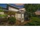 View of the screened in lanai featuring a view of the lush landscaping at 42 Enclave Dr, Winter Haven, FL 33884