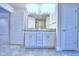 Bright bathroom features a double sink vanity, a large mirror and sleek fixtures at 4202 Teeling Ct, Auburndale, FL 33823