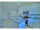 Modern kitchen with white cabinets, granite countertops and stainless steel appliances at 4202 Teeling Ct, Auburndale, FL 33823