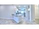 Open kitchen featuring granite counters, white cabinetry and stainless steel appliances at 4202 Teeling Ct, Auburndale, FL 33823