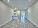 Bright living room boasts tile floors with an eat-in kitchen bar adding character and functionality at 4202 Teeling Ct, Auburndale, FL 33823