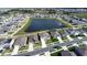 Community aerial view showcasing neighborhood layout with a central pond at 421 Chayne Pl, St Cloud, FL 34771