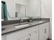 Modern bathroom featuring a double sink vanity with sleek countertops and ample cabinet space at 421 Chayne Pl, St Cloud, FL 34771