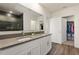 Stylish bathroom with double vanity, walk-in closet, and a modern glass-enclosed shower at 421 Chayne Pl, St Cloud, FL 34771