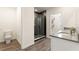 Modern bathroom featuring sleek tile, glass-enclosed shower, and contemporary fixtures at 421 Chayne Pl, St Cloud, FL 34771