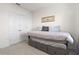 Neutral bedroom with a daybed, trundle, carpeted floor, and a double door closet at 421 Chayne Pl, St Cloud, FL 34771