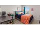 Vibrant bedroom with a desk, comfortable bed, bright window, and fun decorations at 421 Chayne Pl, St Cloud, FL 34771