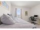 Sunlit bedroom with a daybed and trundle, carpeted floor, and a workstation by the window at 421 Chayne Pl, St Cloud, FL 34771