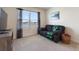 Bright bonus room offers a cozy seating area and scenic exterior views at 421 Chayne Pl, St Cloud, FL 34771