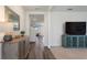 Inviting hallway featuring wood-look floors and stylish furniture at 421 Chayne Pl, St Cloud, FL 34771