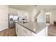 Modern kitchen featuring stainless steel appliances, a large island, and white cabinets at 421 Chayne Pl, St Cloud, FL 34771