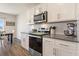Updated kitchen with stainless steel appliances and white cabinets at 421 Chayne Pl, St Cloud, FL 34771