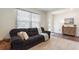 Comfortable living room featuring plush sofa, soft textures, and natural light at 421 Chayne Pl, St Cloud, FL 34771
